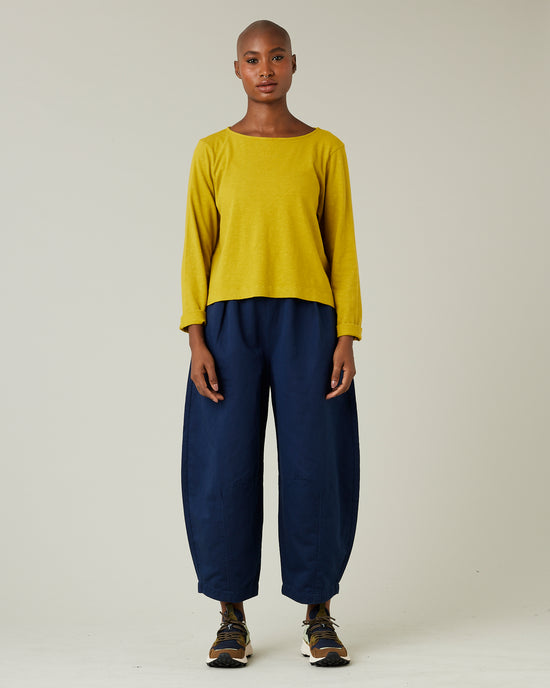 model wears navy daisy twill trousers