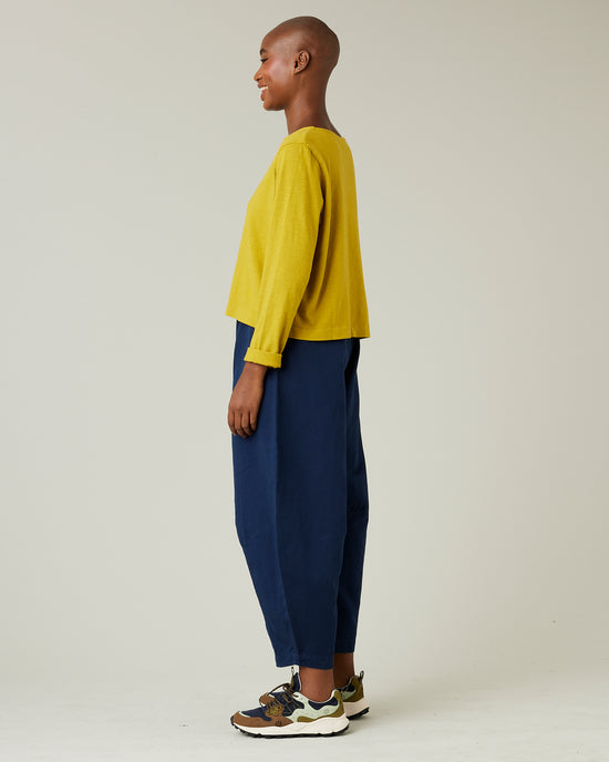 model wears navy daisy twill trousers