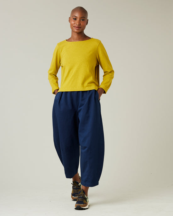 model wears navy daisy twill trousers