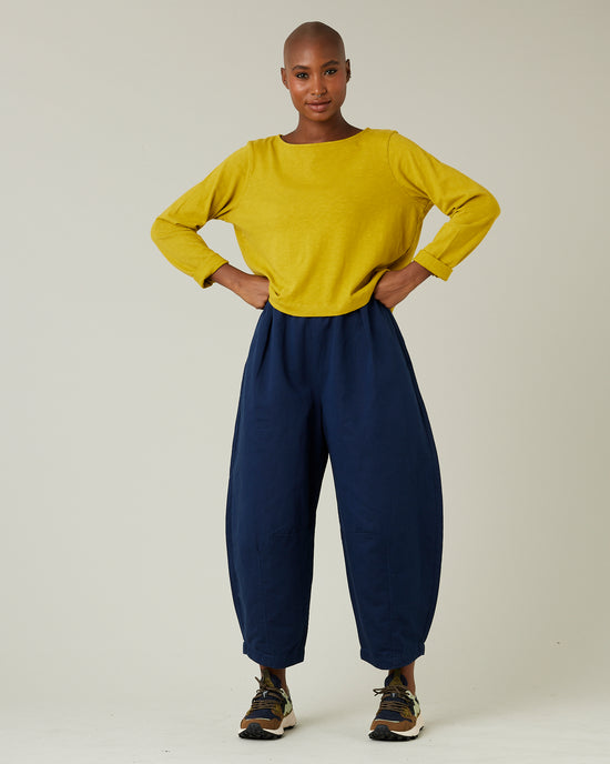 model wears navy daisy twill trousers