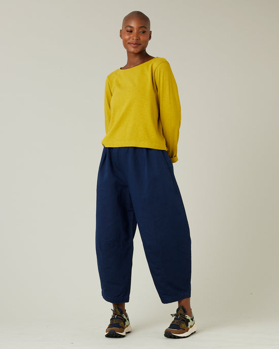 model wears navy daisy twill trousers