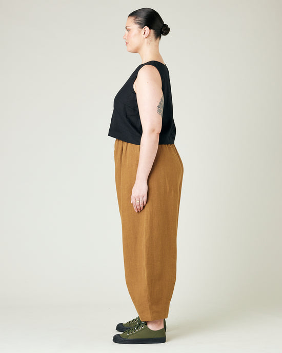 model wears bronze daisy linen trousers