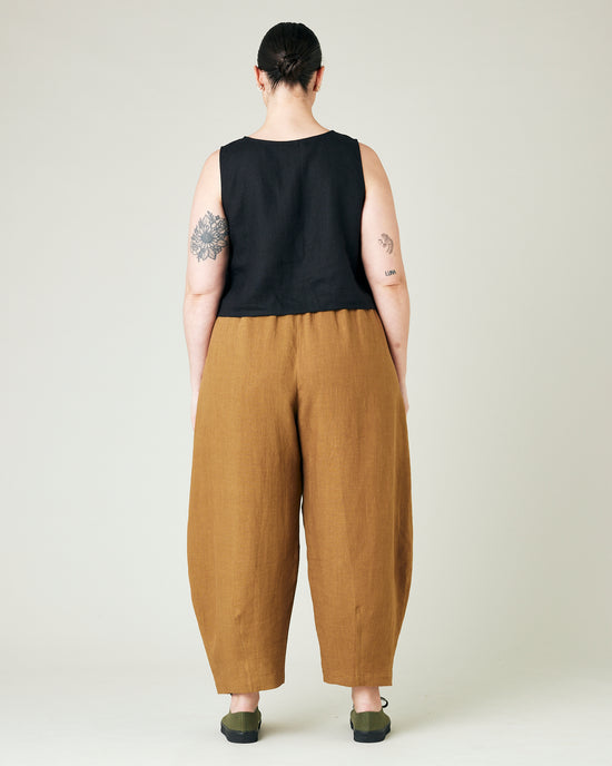 model wears bronze daisy linen trousers