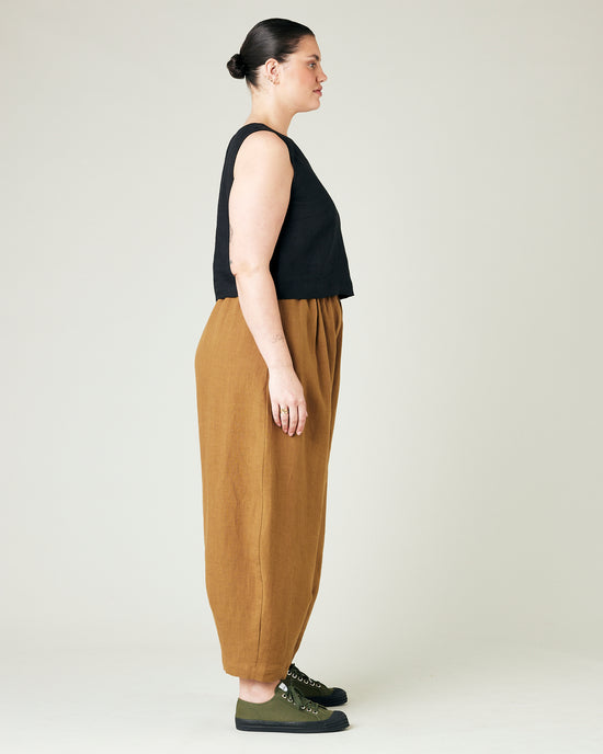 model wears bronze daisy linen trousers