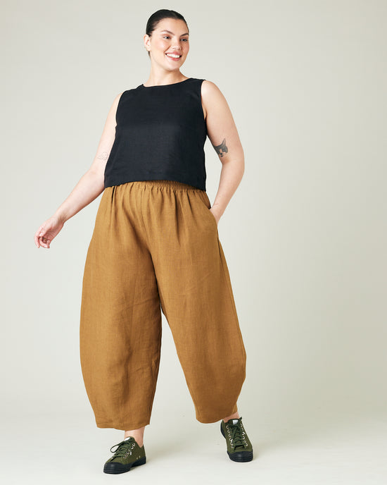 model wears bronze daisy linen trousers