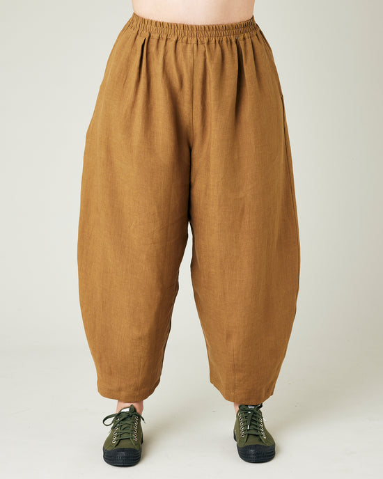 model wears bronze daisy linen trousers