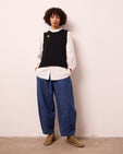 model wears daisy mid blue light weight denim trousers