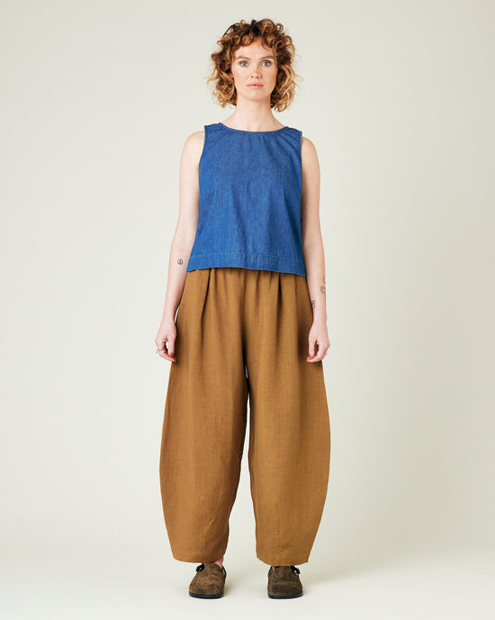 model wears bronze daisy linen trousers