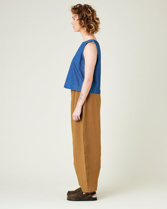 model wears bronze daisy linen trousers