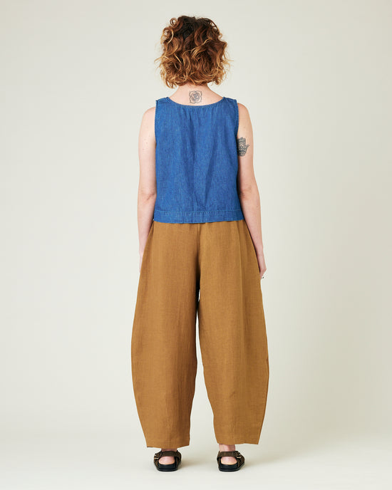 model wears bronze daisy linen trousers