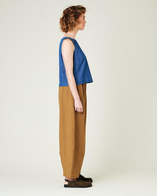 model wears bronze daisy linen trousers