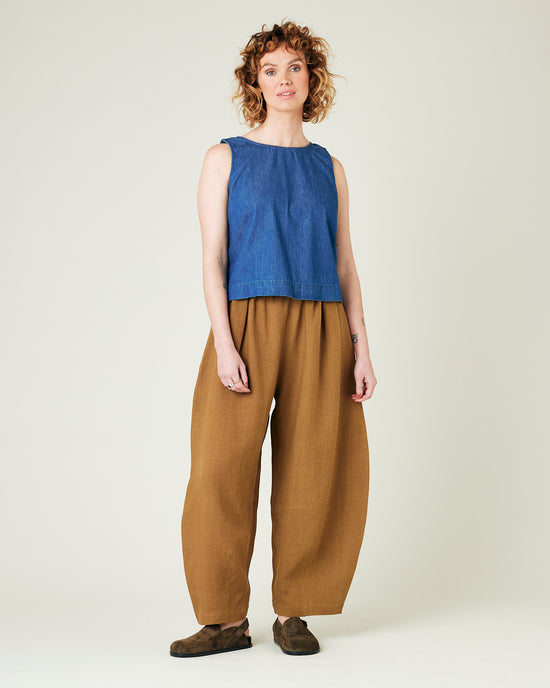 model wears bronze daisy linen trousers