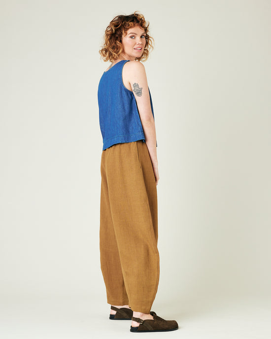 model wears bronze daisy linen trousers