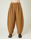 model wears bronze daisy linen trousers front