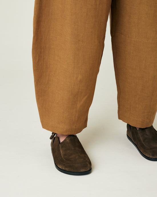 model wears bronze daisy linen trousers