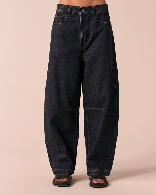 model wears echo washed black denim jeans front