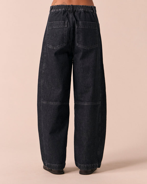model wears echo washed black denim jeans back