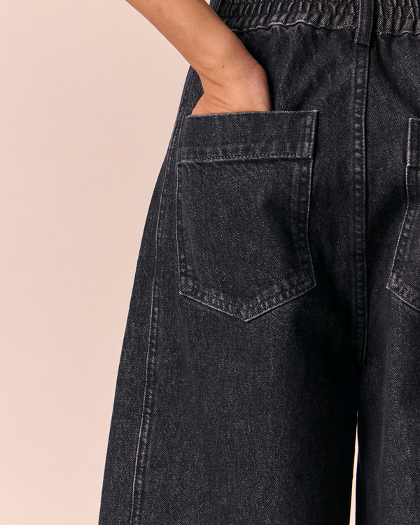 model wears echo washed black denim jeans