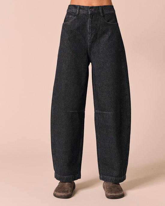 model wears echo steel blue denim jeans front