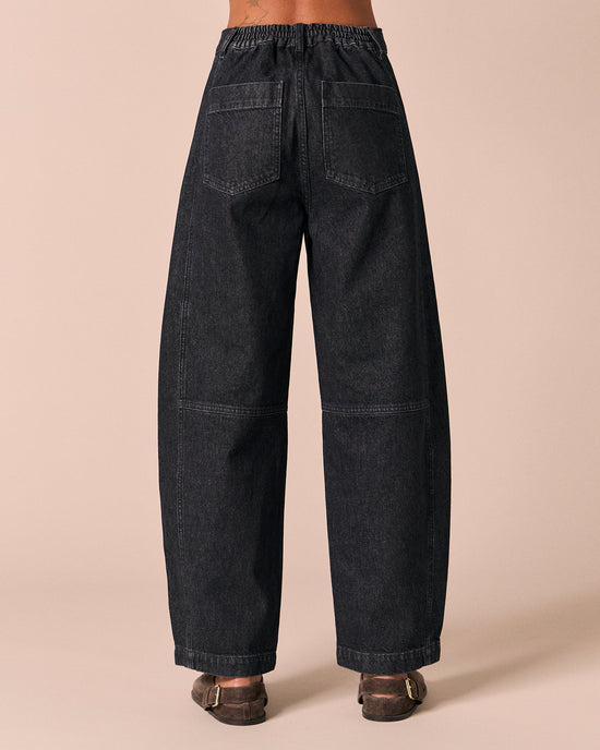 model wears echo steel blue denim jeans back
