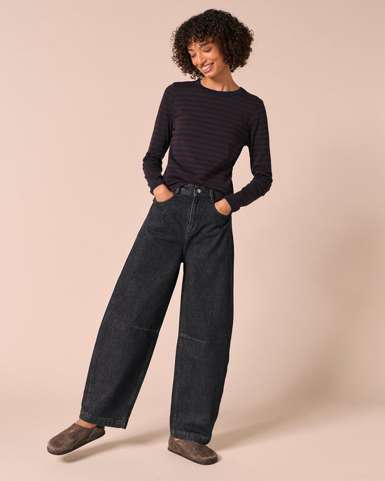 model wears echo steel blue denim jeans left