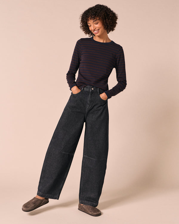 model wears echo steel blue denim jeans left