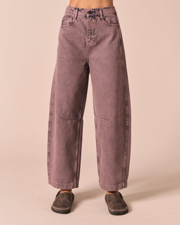 model wears echo smoked lilac denim jeans front