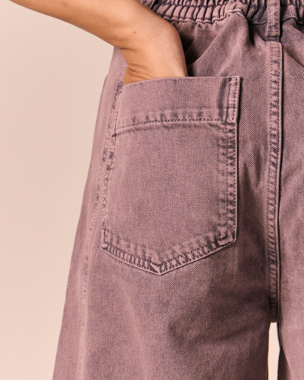 model wears echo smoked lilac denim jeans
