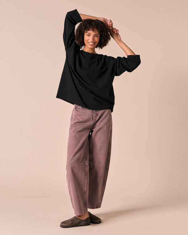 model wears echo smoked lilac denim jeans right