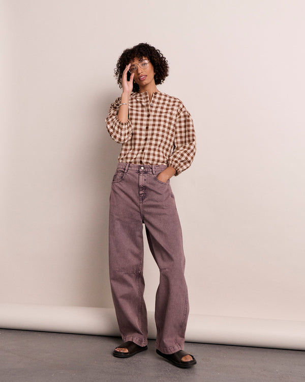 model wears echo smoked lilac denim jeans