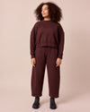 model wears eden black cherry jersey jumper and lyra black cherry jersey trousers