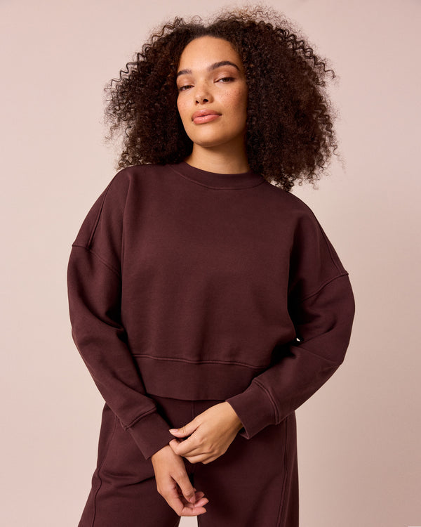 model wears eden black cherry eden jumper