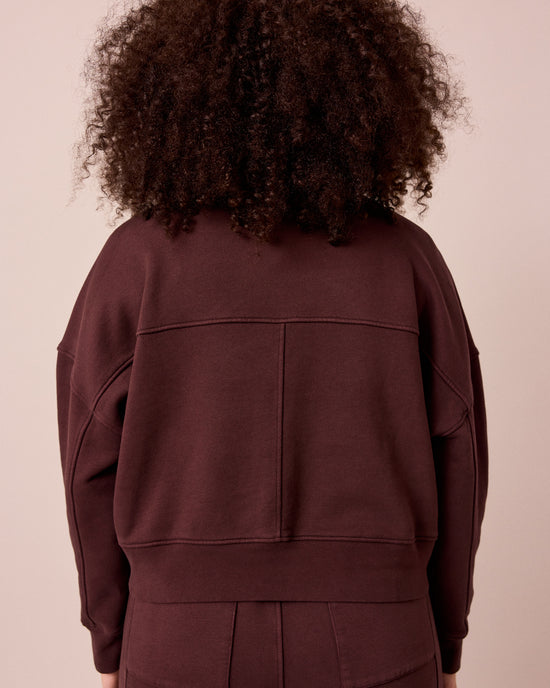 model wears eden black cherry eden jumper