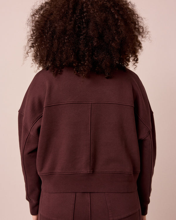 model wears eden black cherry eden jumper