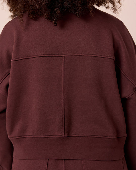 model wears eden black cherry eden jumper