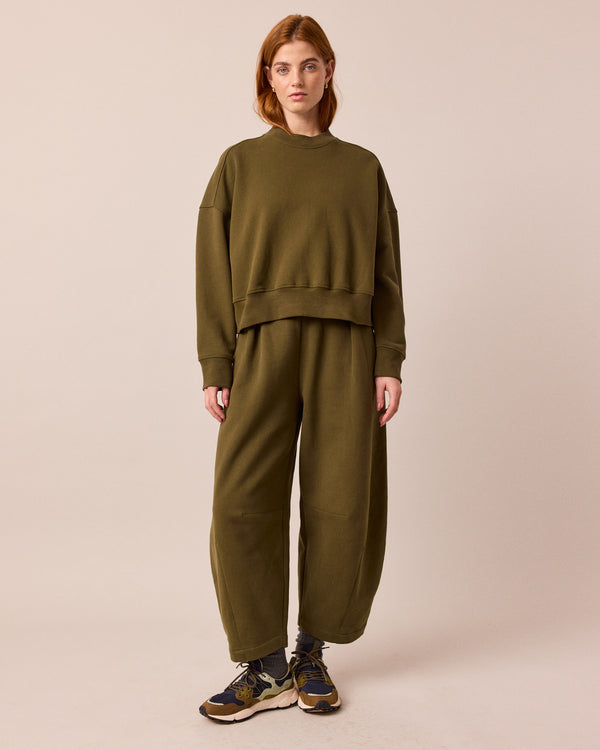 model wears eden earth green jersey jumper