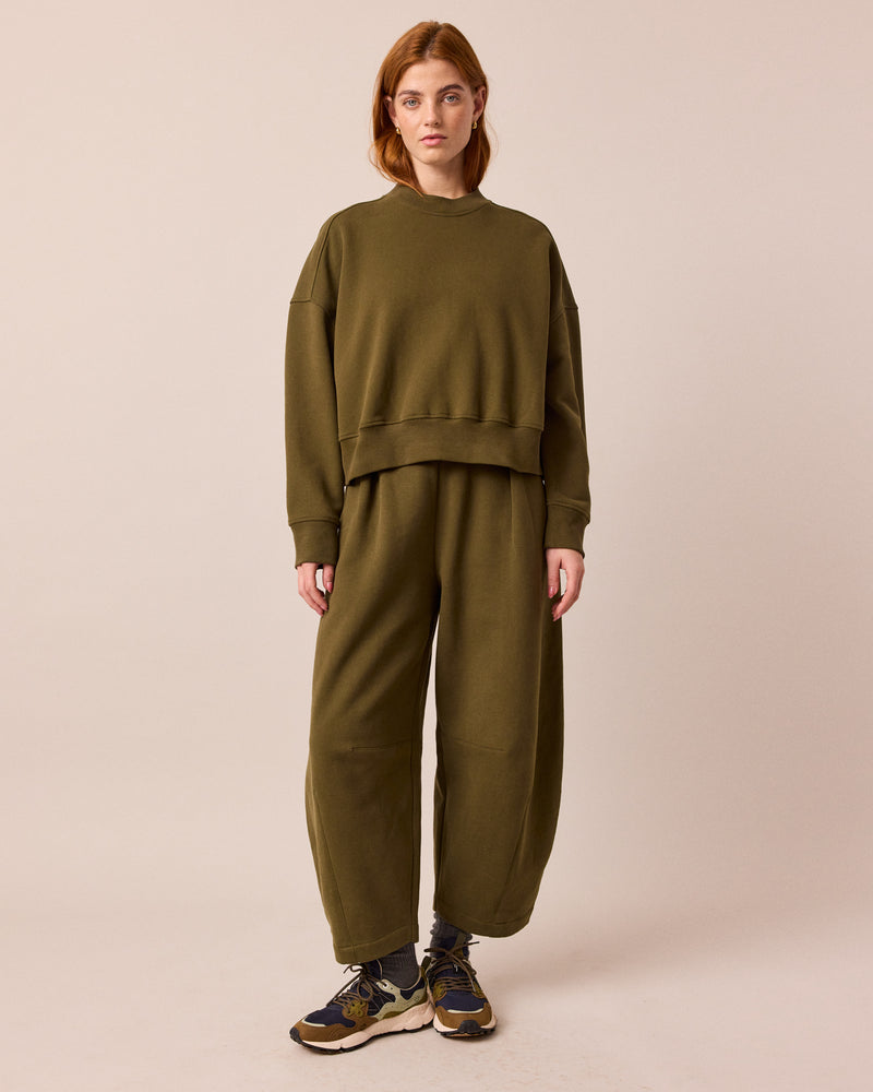 model wears eden earth green jersey jumper