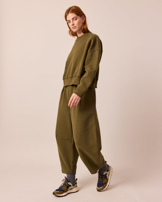 model wears eden earth green jersey jumper