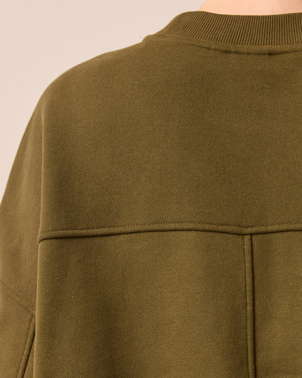 model wears eden earth green jersey jumper