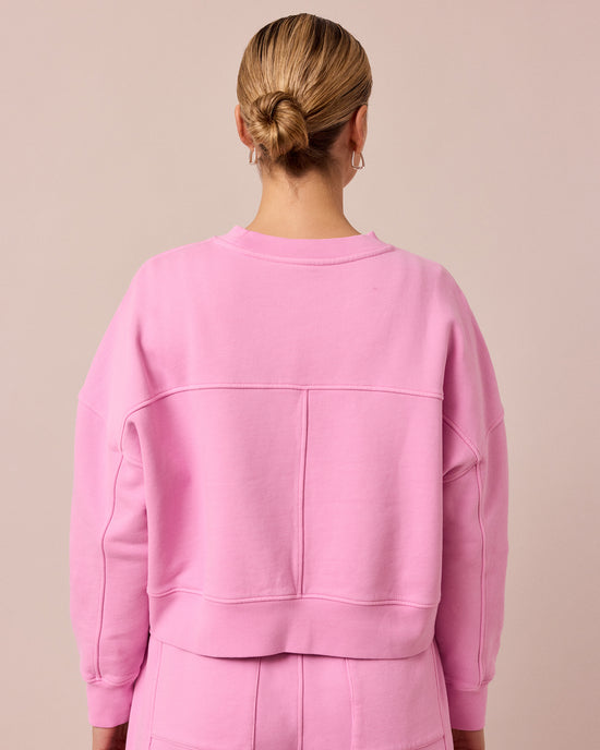 model wears eden washed pink jersey jumper