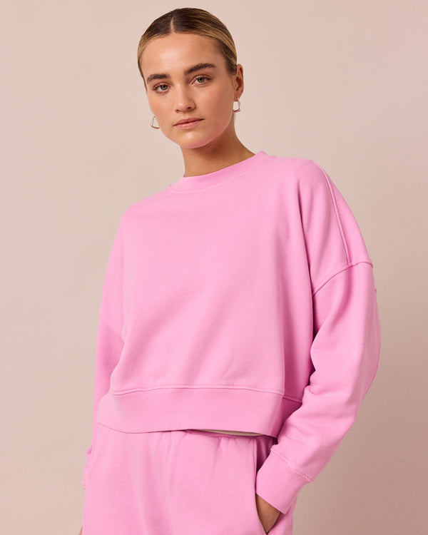 model wears eden washed pink jersey jumper