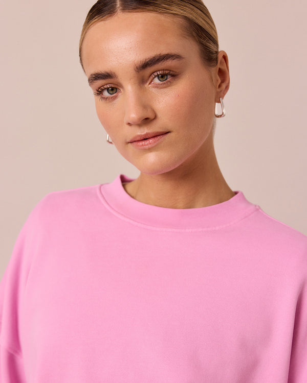 model wears eden washed pink jersey jumper