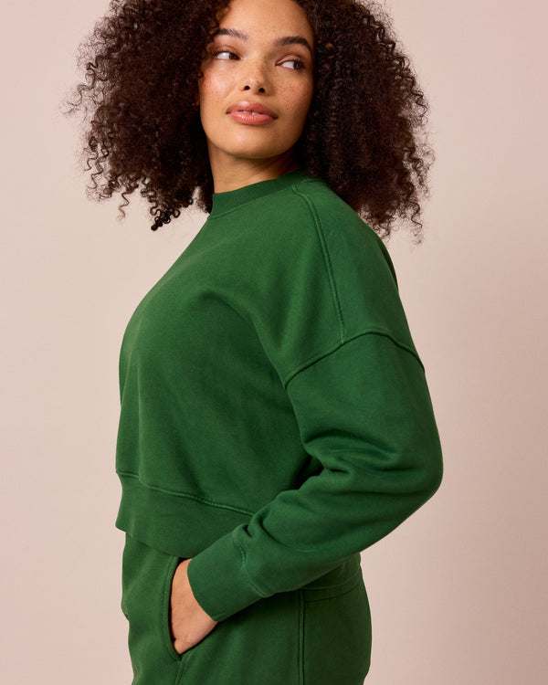 model wears eden verdant green fleeceback jersey jumper