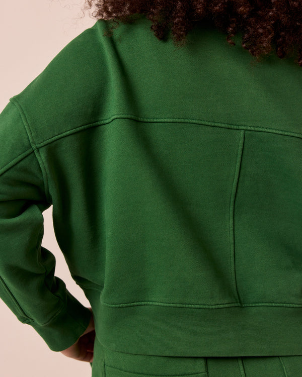 model wears eden verdant green fleeceback jersey jumper