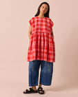 model wears ella pink lemonade cotton linen dress