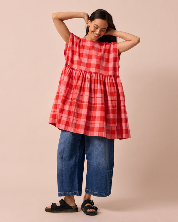 model wears ella pink lemonade cotton linen dress