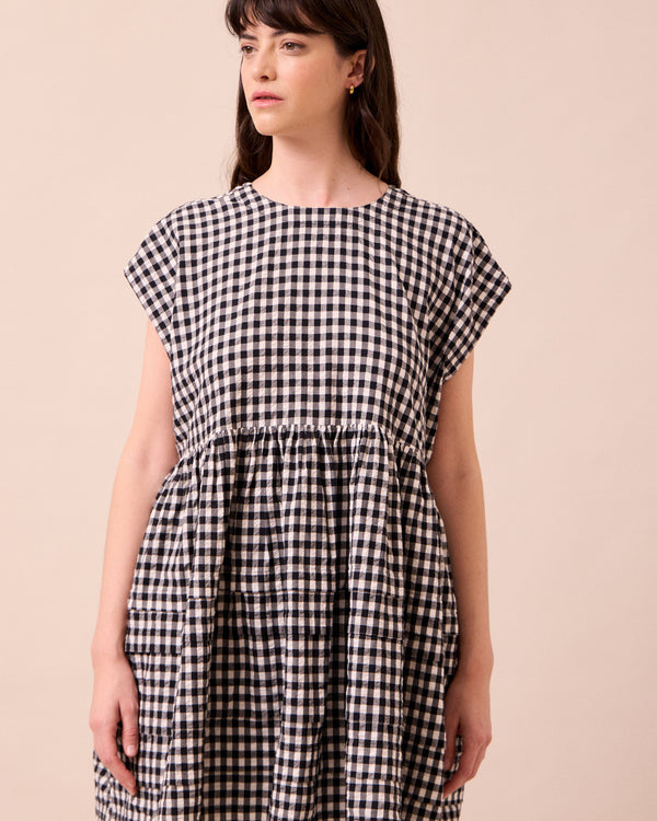 model wears ella black and white gingham seersucker dress