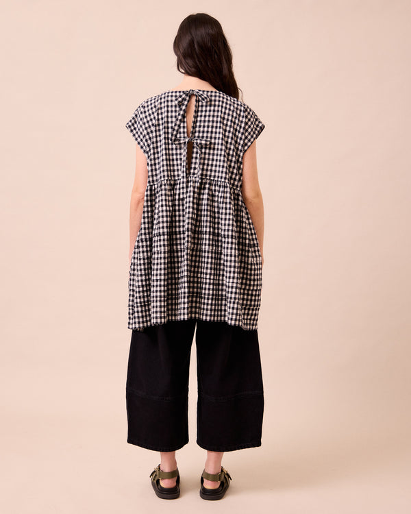 model wears ella black and white gingham seersucker dress