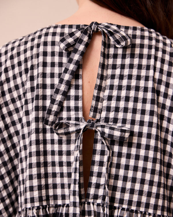 model wears ella black and white gingham seersucker dress