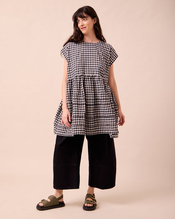 model wears ella black and white gingham seersucker dress